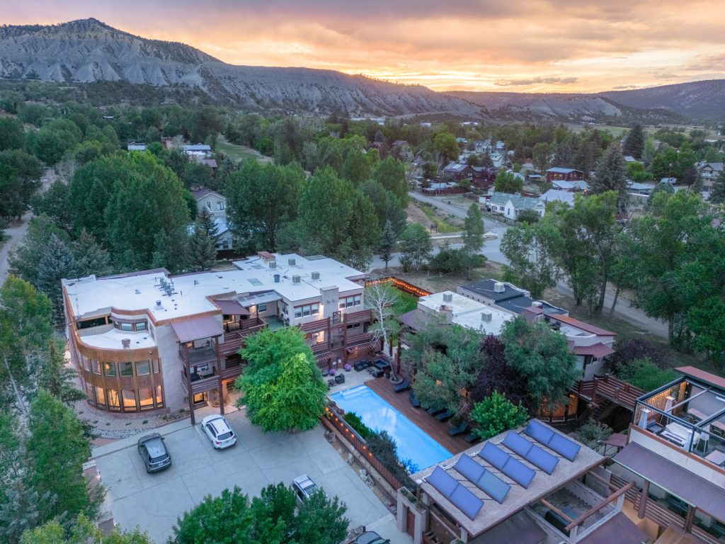 Aerial drone photo of Chipeta Lodge Resort + Spa looking west toward Telluride