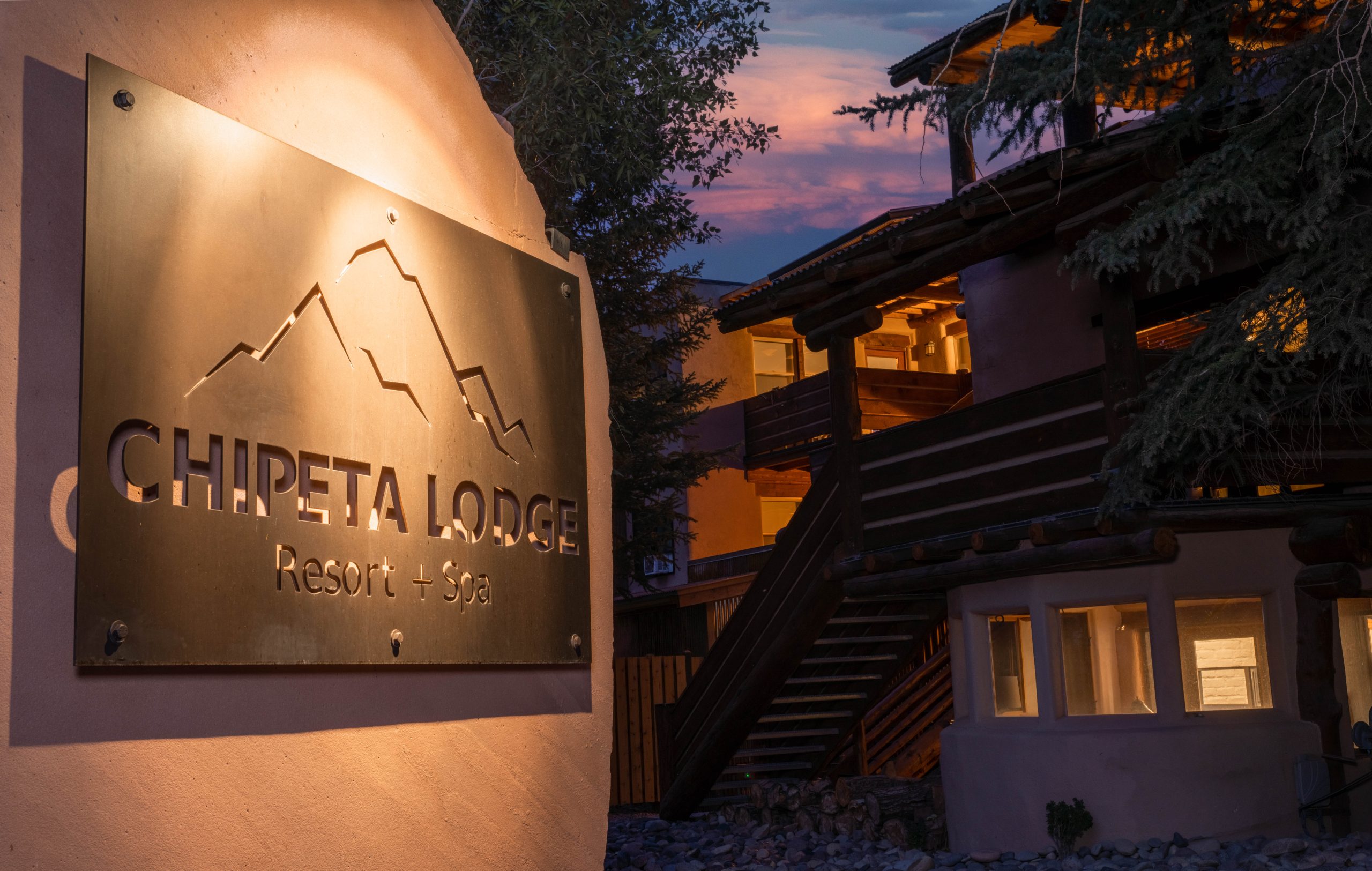 Chipeta-Lodge_Sign-Evening-Closeup - Chipeta Lodge Resort + Spa Chipeta Lodge Resort + Spa close up of sign lit up at sunset