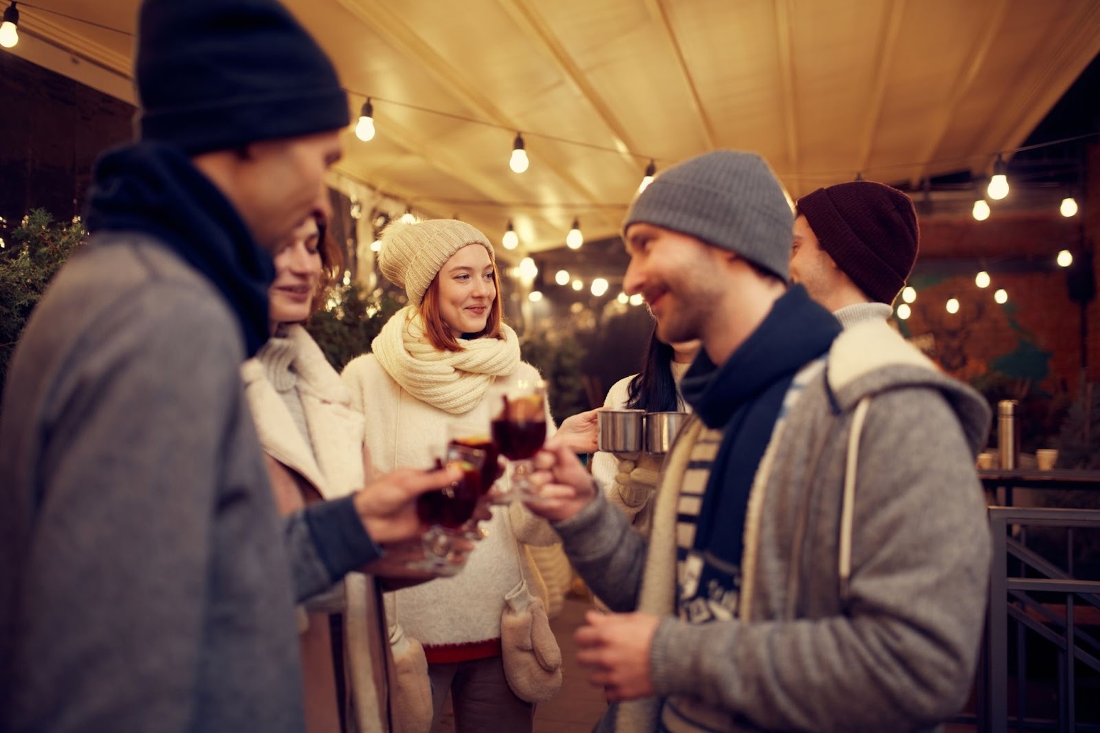 Friends enjoying cocktails on a crisp fall evening at the rooftop White Buffalo Bar at Chipeta Lodge Resort + Spa