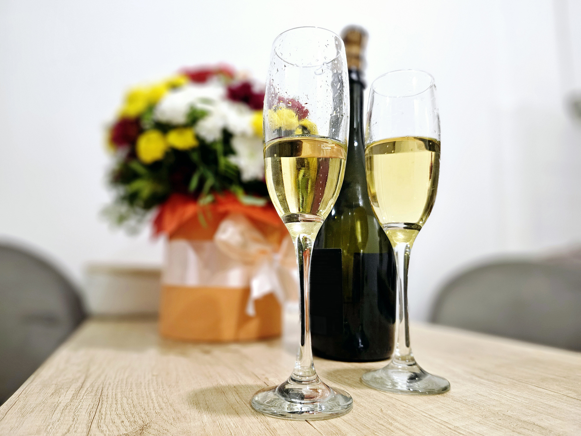 Beautiful flower arrangement and bottle of prosecco included with the San Juan Celebration Package at Chipeta Lodge Resort + Spa