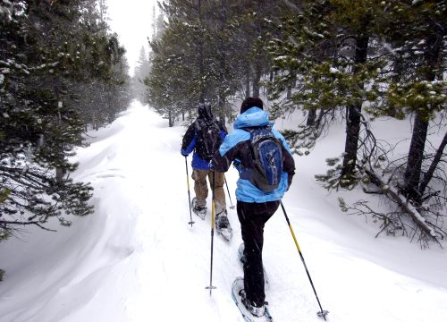 Couple Snowshoeing near Chipeta Lodge Resort + Spa
