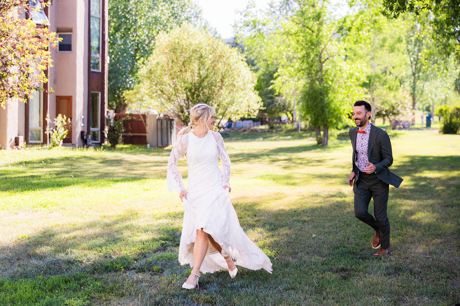 Jason Madison - Chipeta Lodge Wedding - Chipeta Lodge Resort + Spa Groom chasing a bride at Chipeta Lodge Resort + Spa