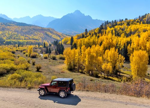Sunny day to explore the colorful valley at base of rugged Sneffels Range near Chipeta Lodge Resort + Spa