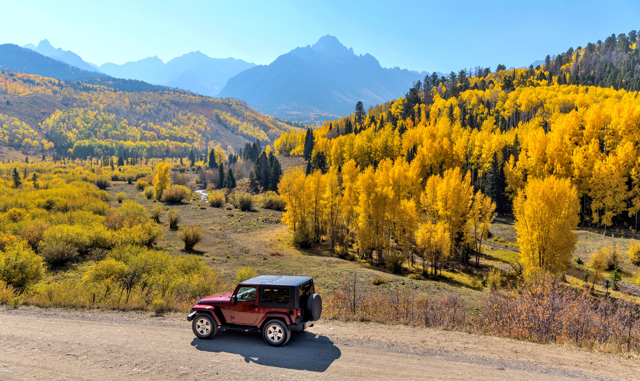 Sunny day to explore the colorful valley at base of rugged Sneffels Range near Chipeta Lodge Resort + Spa
