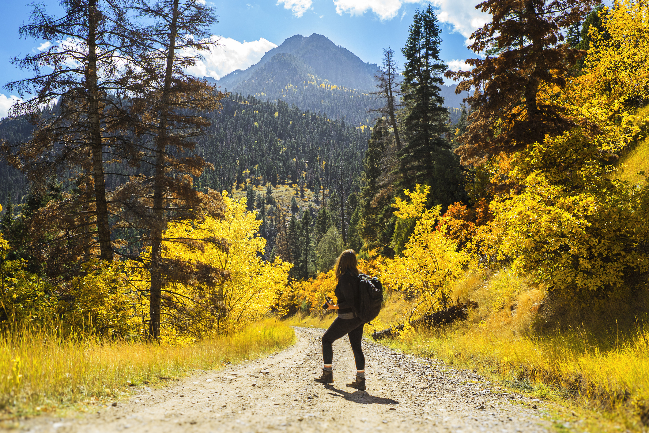 Woman on trail in Ouray near Hayden Mountain, close to Chipeta Lodge Spa + Resort